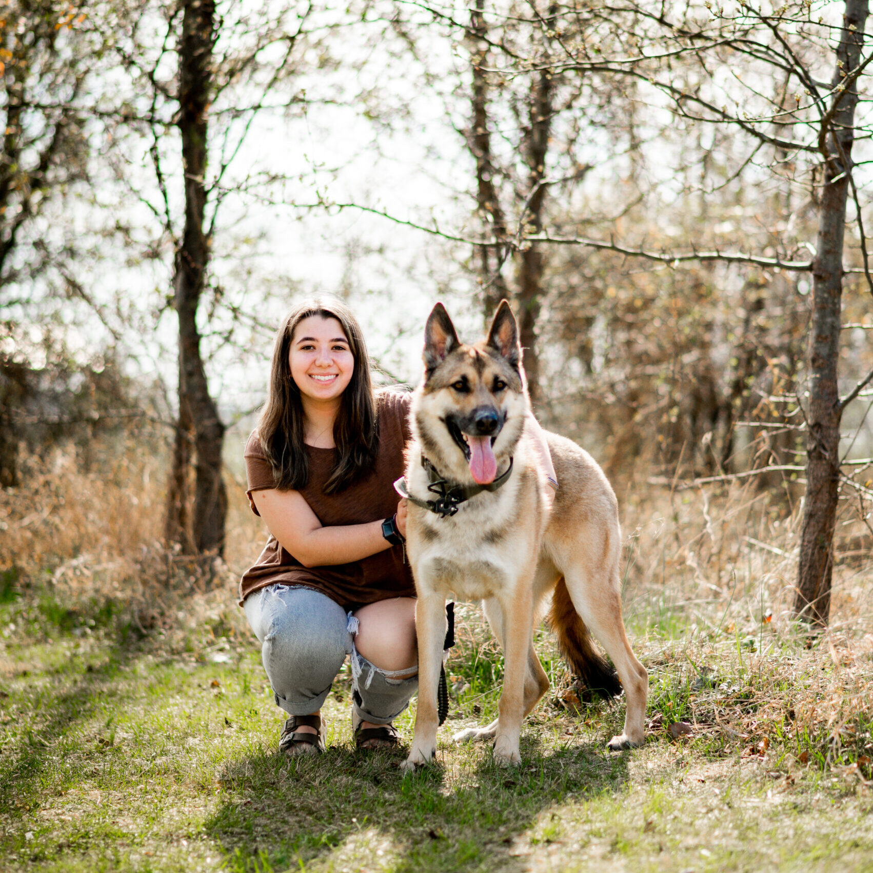 Kennel technician Deziree and her German Shepherd mix, Scout, who she adopted from Greensburg Bed and Biscuit.